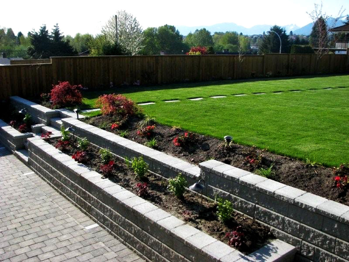 Completed backyard landscape with mountain views by Deerwood Landscaping