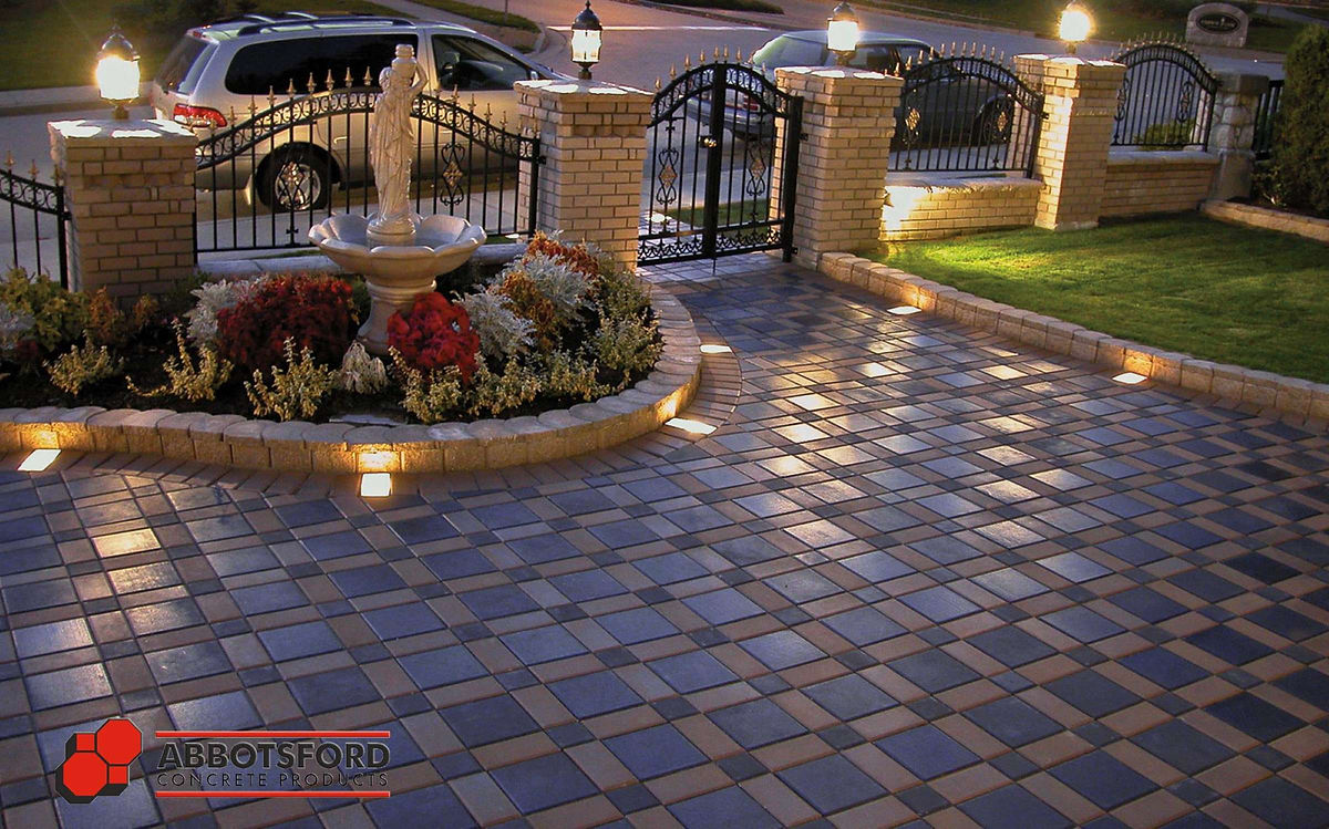 Integrated paver accent lights by Deerwood Landscaping