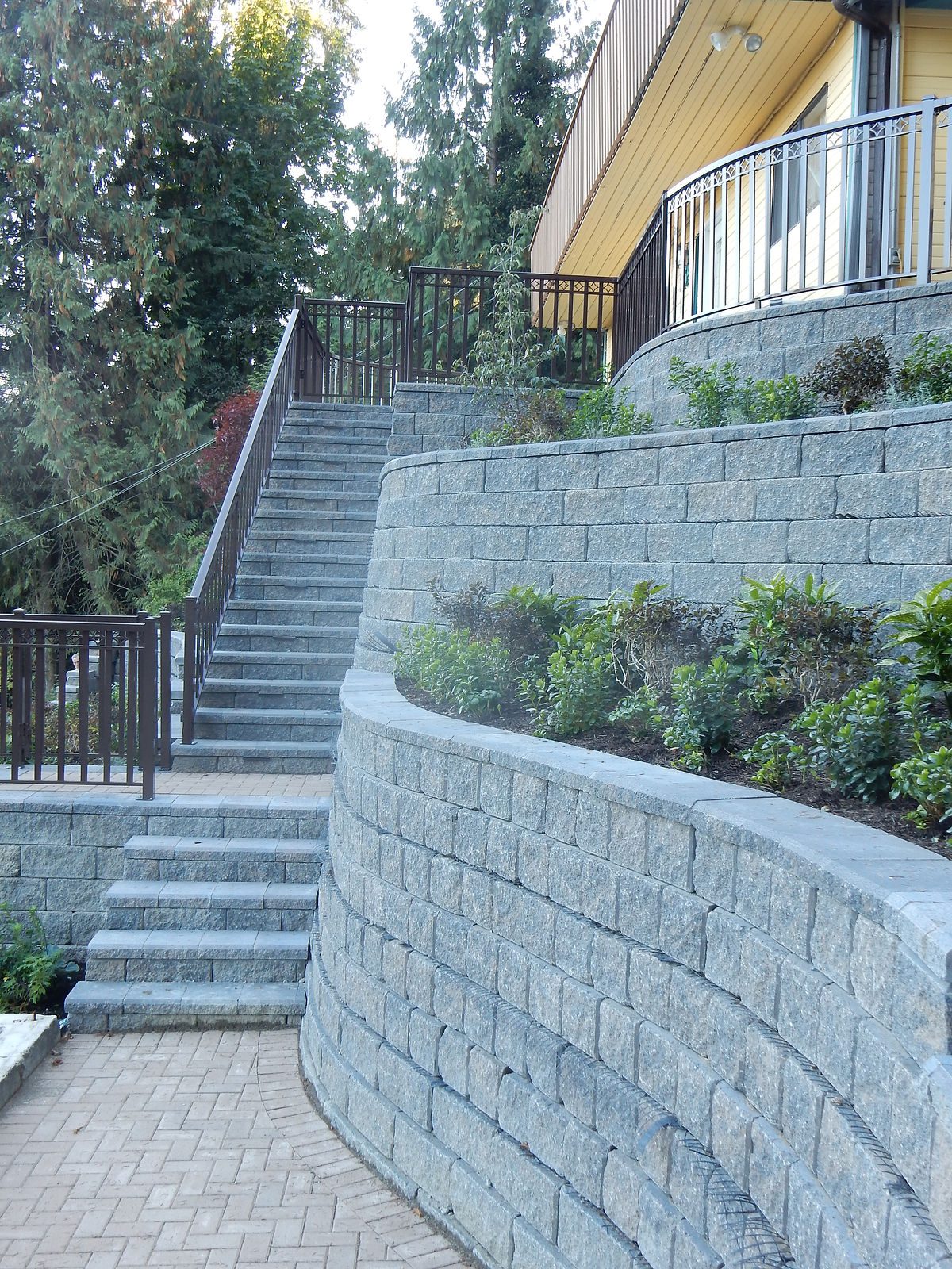 Vertical retaining wall project by Deerwood Landscaping