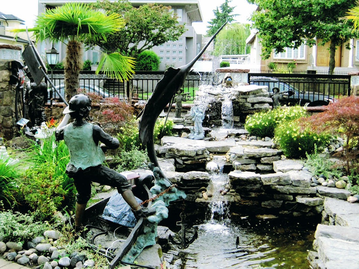 Custom waterfall and pond in Vancouver by Deerwood Landscaping